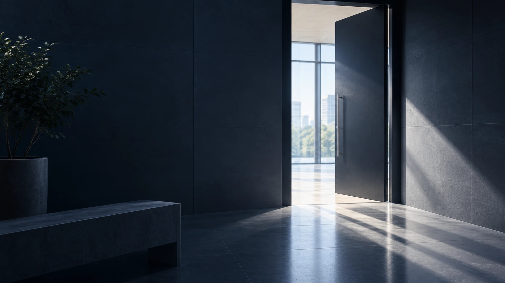 A heavy door standing open in a dark, quiet interior, with daylight spilling across the floor